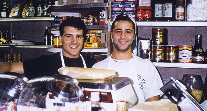 Bill and Emilio Mignucci behind the counter of Di Bruno Brothers circa 1990